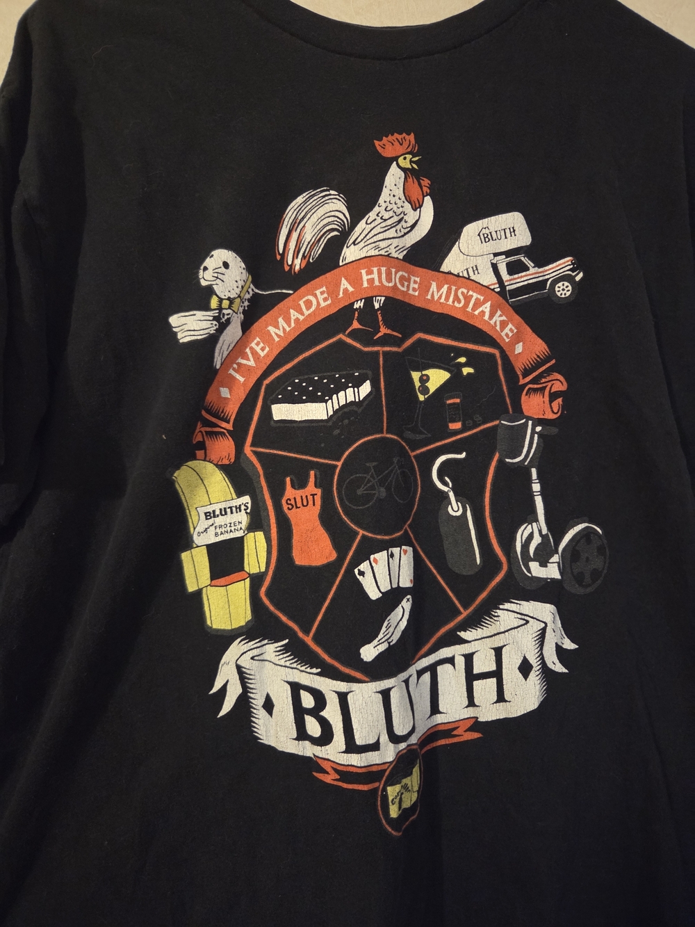 Bluth Company Graphic Tee - Black with Red & White Crest